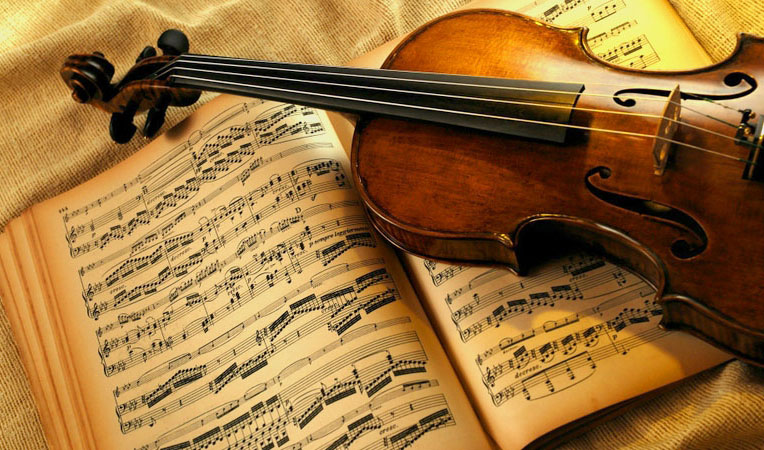 Violin on open music book